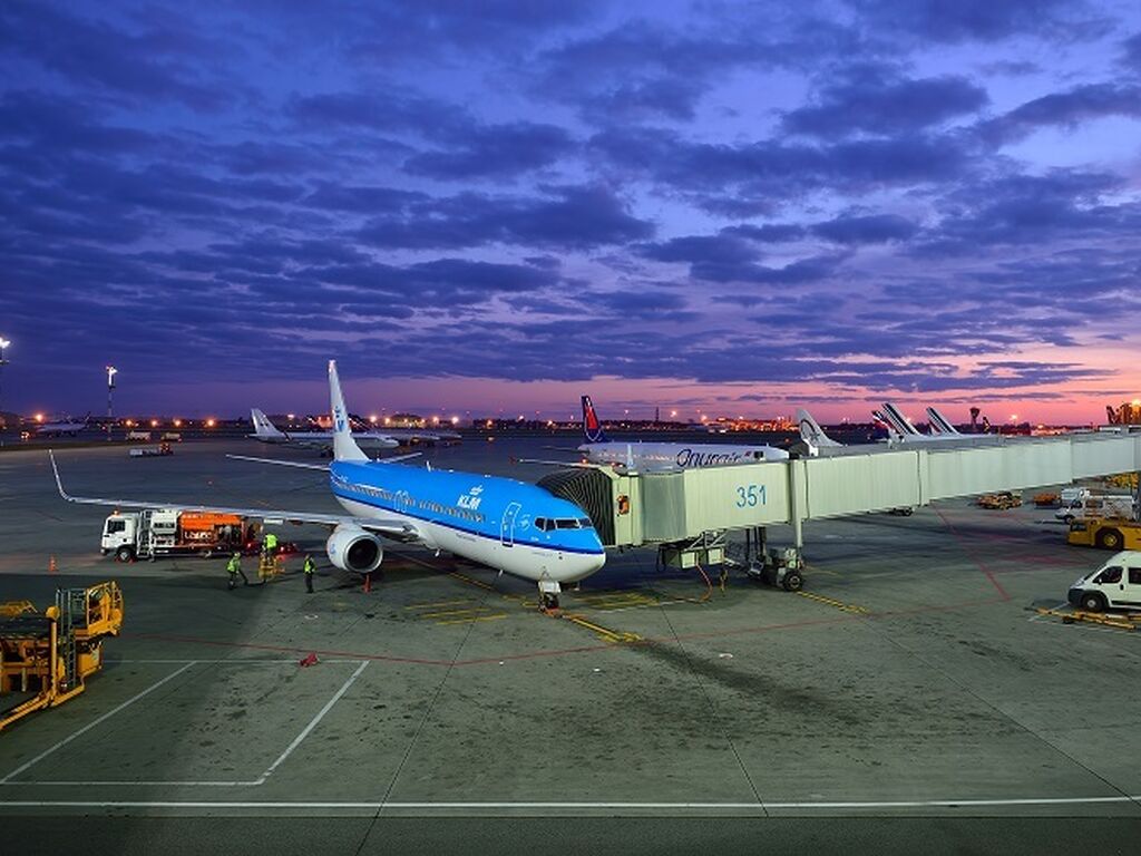 KLM plane connected to passenger tunnel